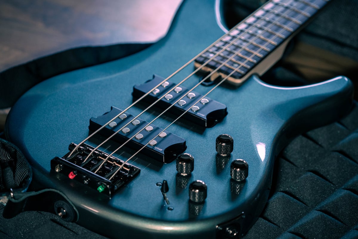 Close-Up Shot of Dark Blue Bass Guitar